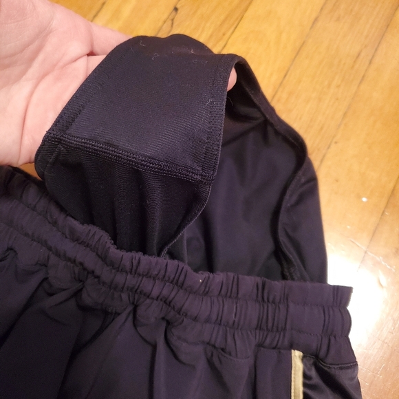 Lululemon Super Squad shorts. Black and gold. Size 6. Built in liner. - Picture 11 of 12